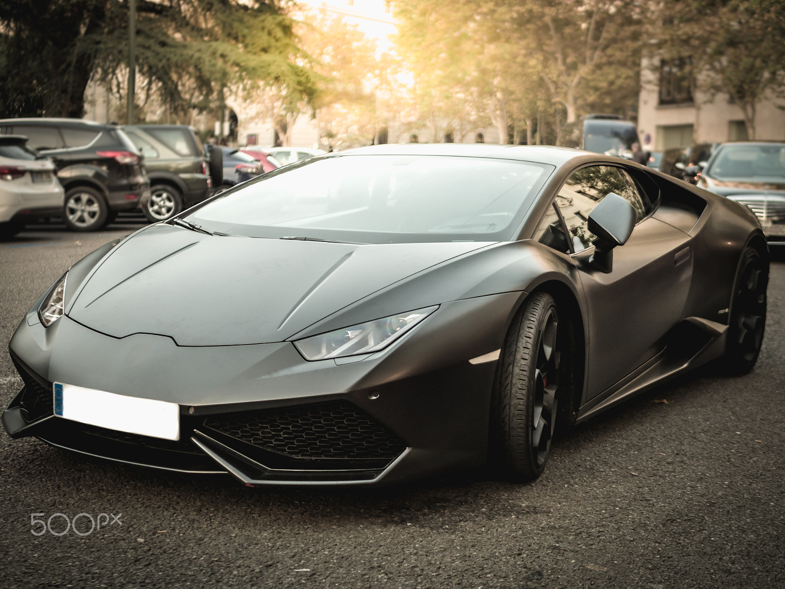 Panasonic Lumix DMC-GH3 + LUMIX G 25/F1.7 sample photo. Luxurious sports black car in the street photography