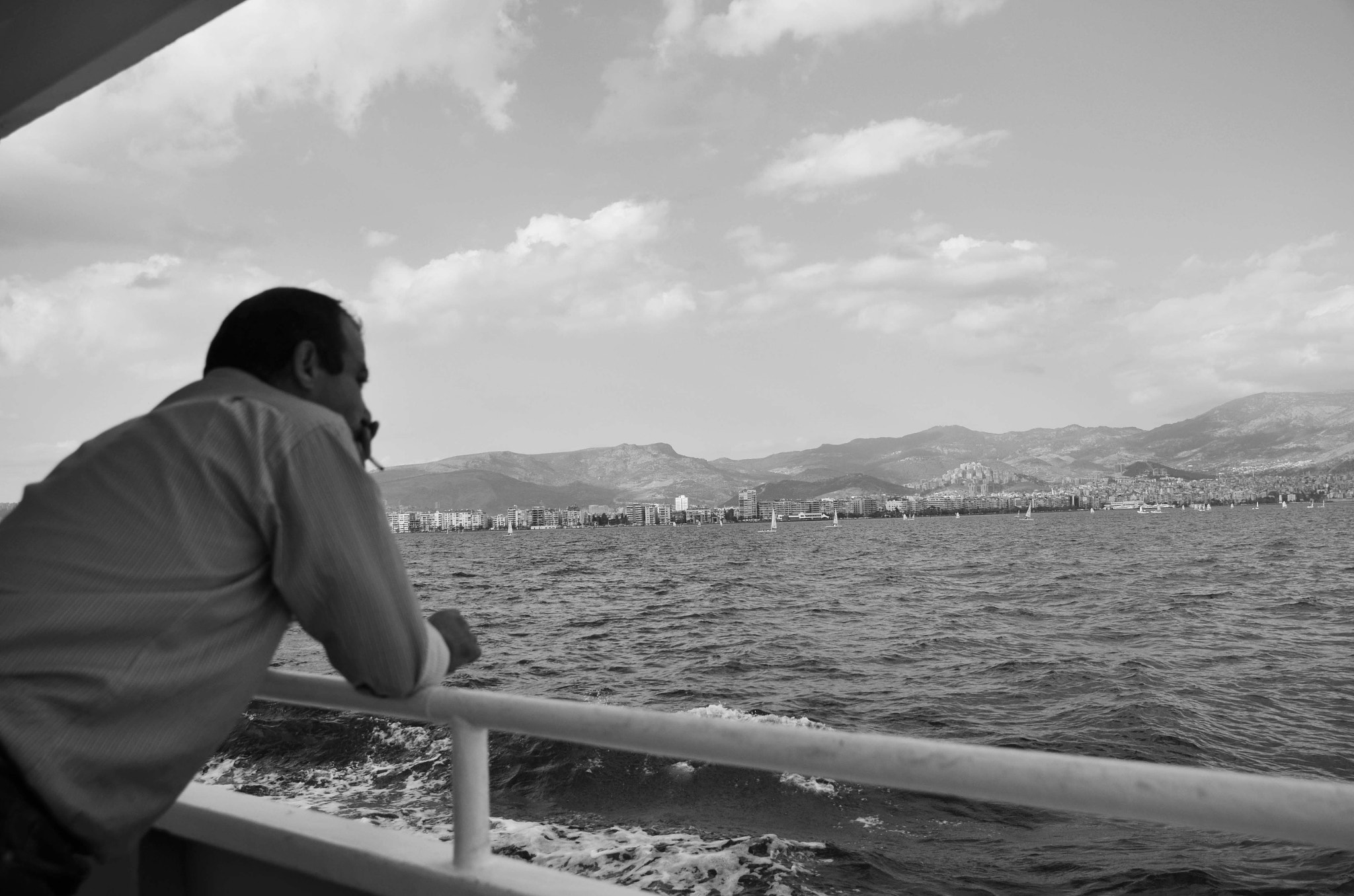 Sigma 17-70mm F2.8-4 DC Macro OS HSM sample photo. The man looks at sea photography
