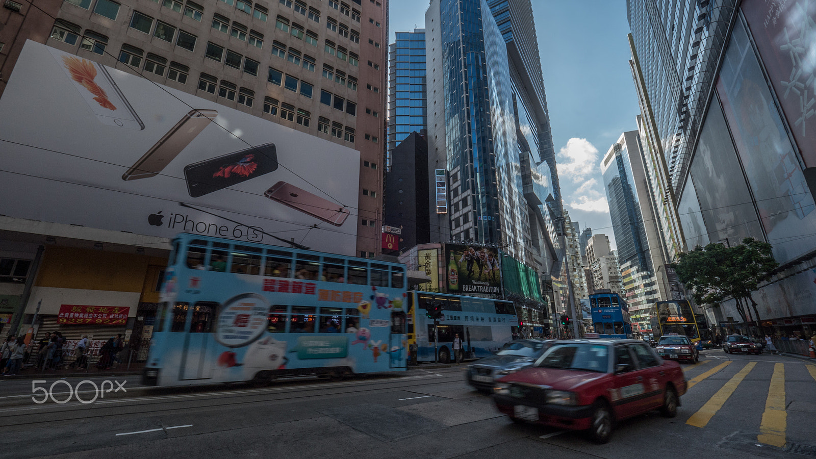 Panasonic Lumix DMC-GH4 + Olympus M.Zuiko Digital ED 7-14mm F2.8 PRO sample photo. Timelapse of street in concrete jungle of hong kong photography