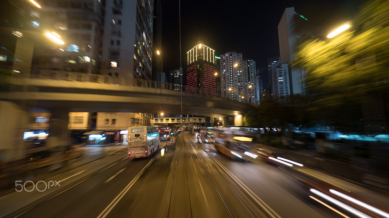 Panasonic Lumix DMC-GH4 + Olympus M.Zuiko Digital ED 7-14mm F2.8 PRO sample photo. Night hong kong cityscape with transport traffic on the road photography