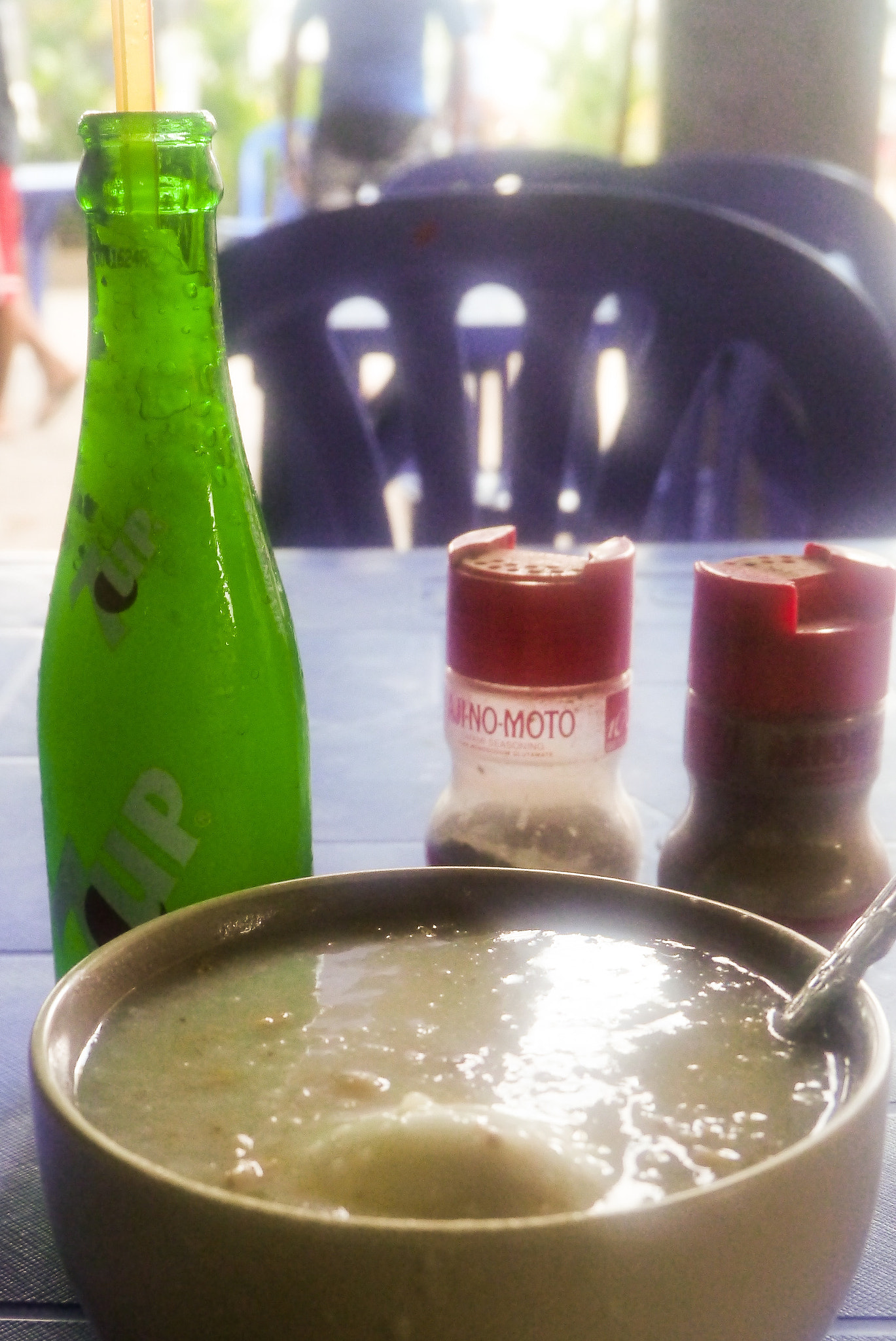 Panasonic Lumix DMC-GX1 sample photo. $1 snack = lugaw (congee) + egg + frozen 7up photography