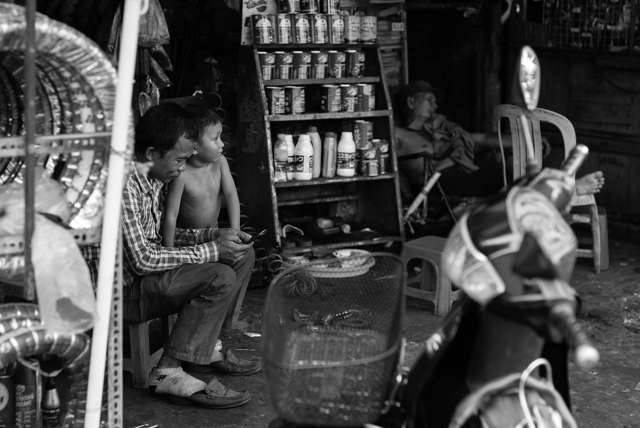 Sony a7S sample photo. Phnom penh - motorcycle parts store photography
