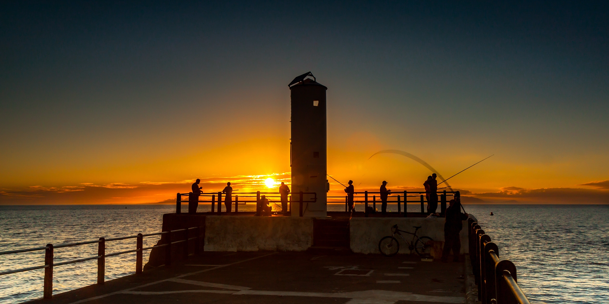Canon EOS 500D (EOS Rebel T1i / EOS Kiss X3) sample photo. Pier fishing at sunset photography
