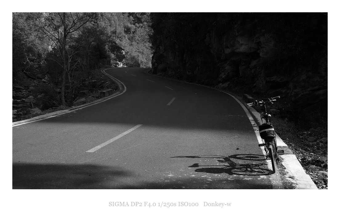 Sigma DP2 sample photo. Cycling alone in the mountains photography