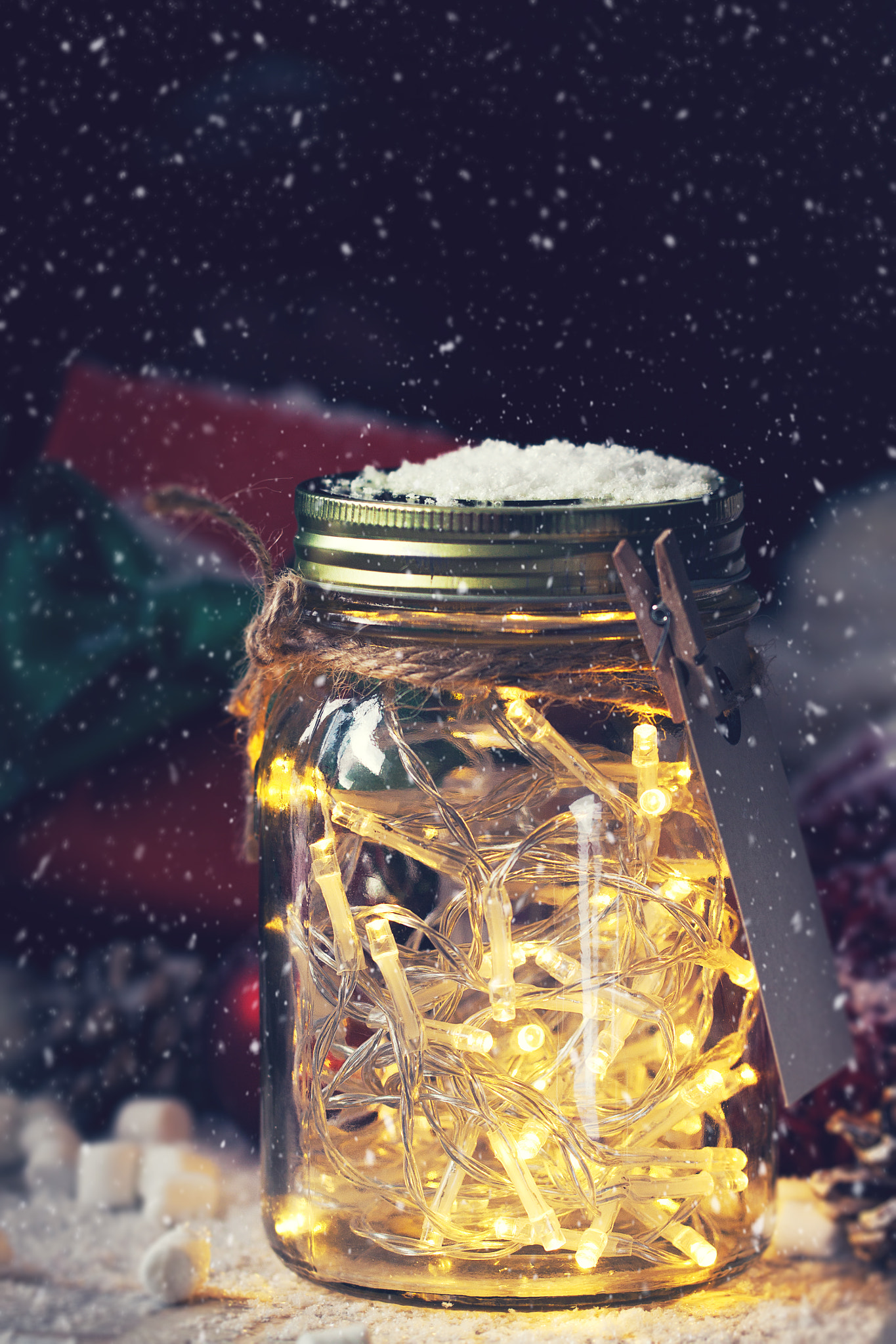 Fairy christmas holiday lights in a jar with christmas decoratio