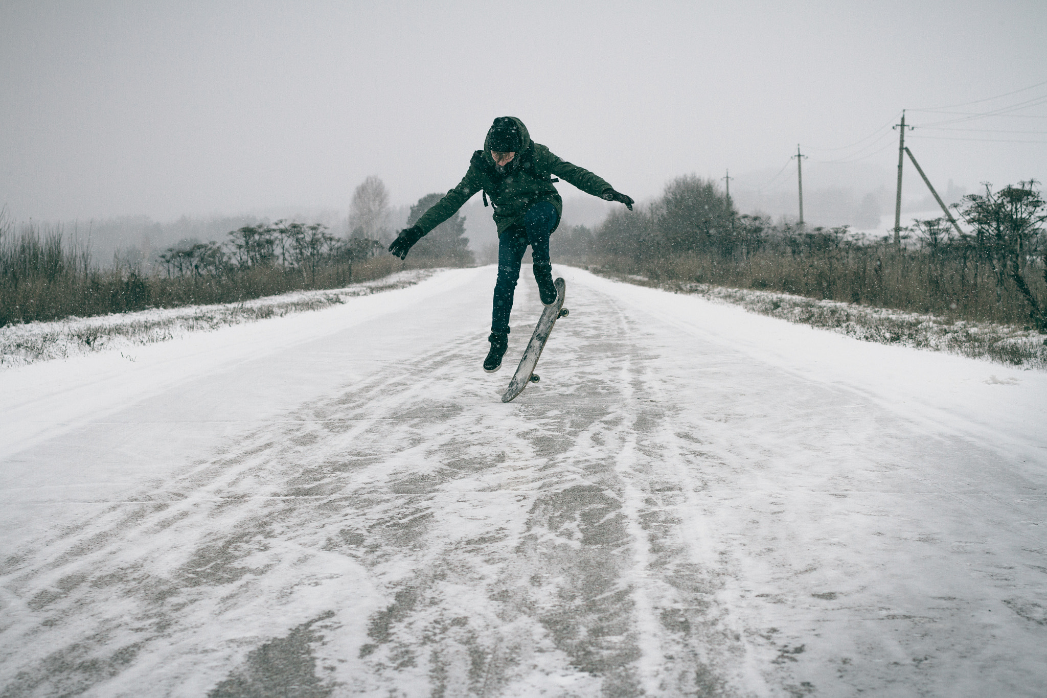 Canon EOS 7D sample photo. A young boy riding his skateboard in the winter. photography