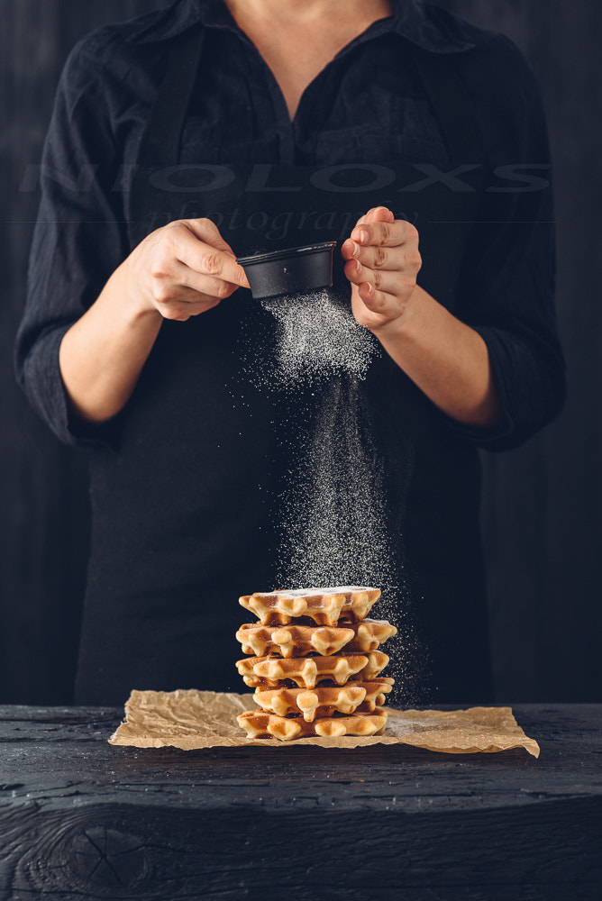 Nikon D610 sample photo. Female waffles sprinkled with icing sugar photography