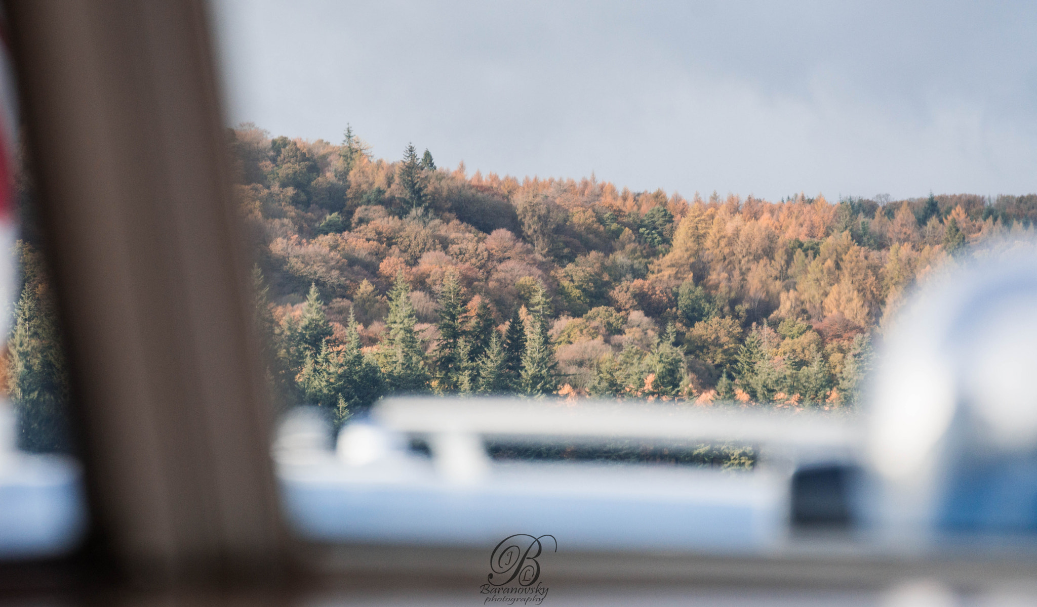 Sony a6000 sample photo. View from the boats window on windermere lake towards forest photography