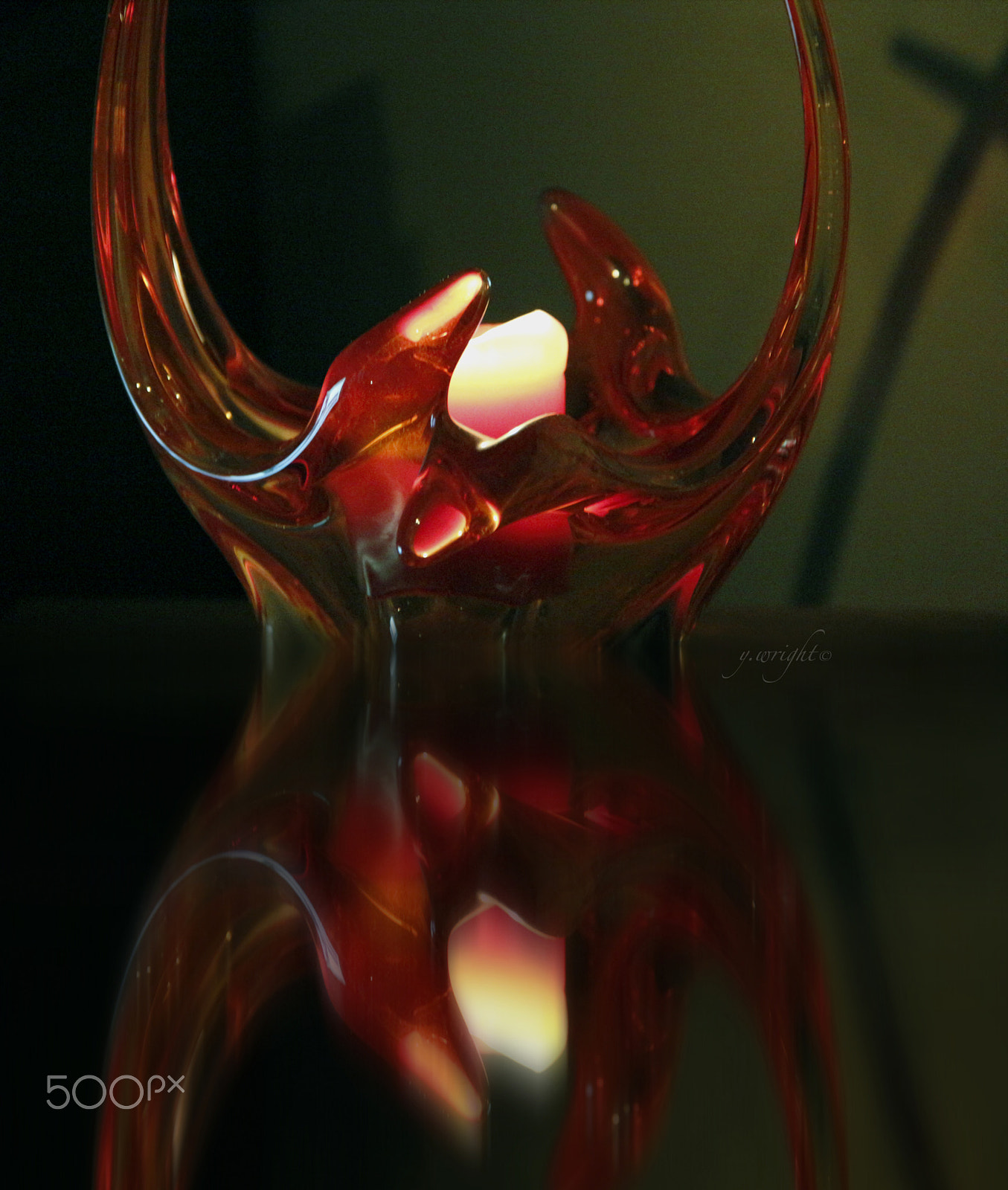 Canon EF-S 18-200mm F3.5-5.6 IS sample photo. Red glass dish with glowing candle photography