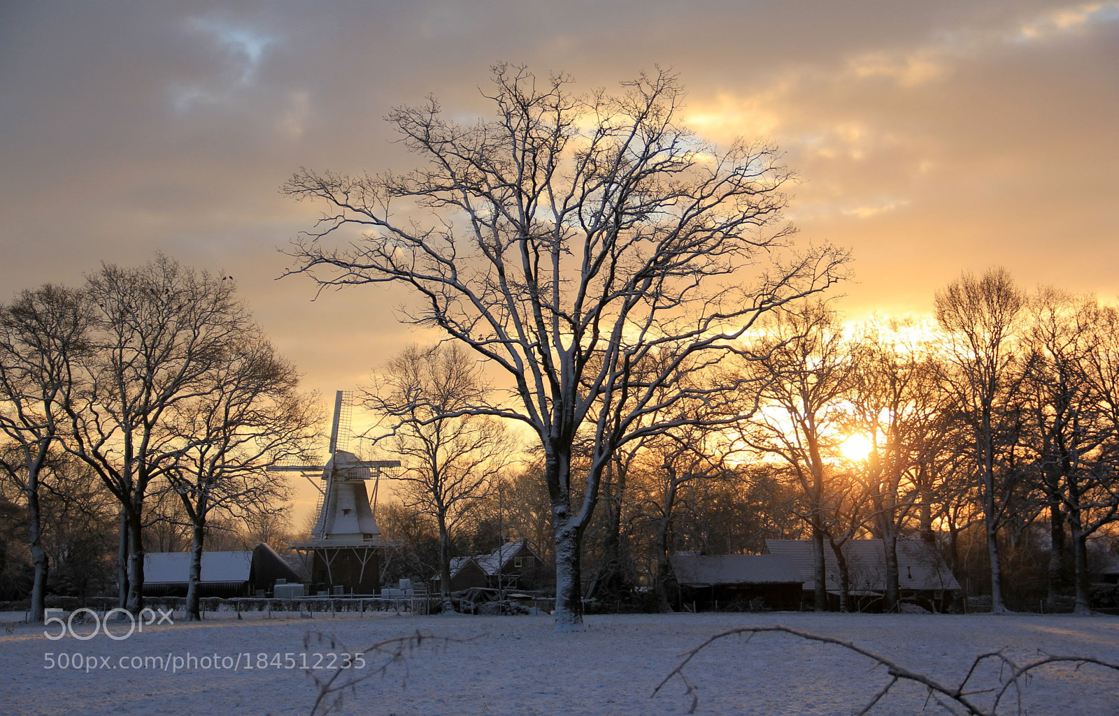 Canon EF-S 18-135mm F3.5-5.6 IS sample photo. Dutch mill in snow photography