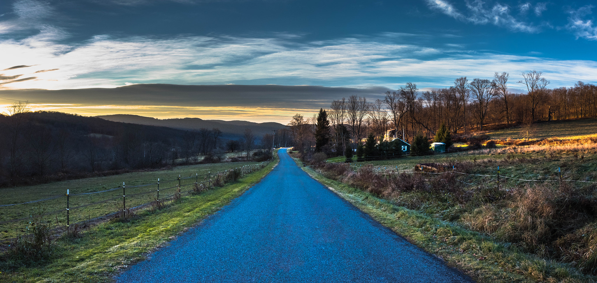 Nikon AF-S Nikkor 17-35mm F2.8D ED-IF sample photo. Sunrise creeps over dunk hill road photography