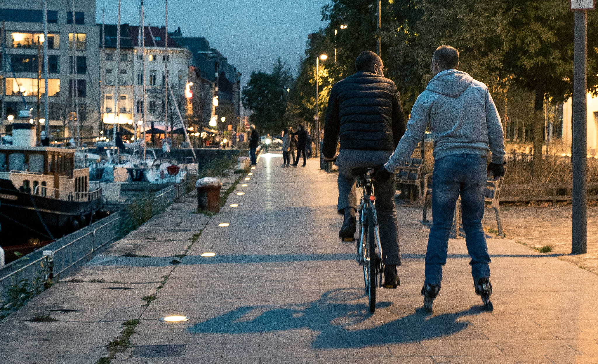 24-70mm F2.8 G SSM sample photo. Bicycle and skater photography