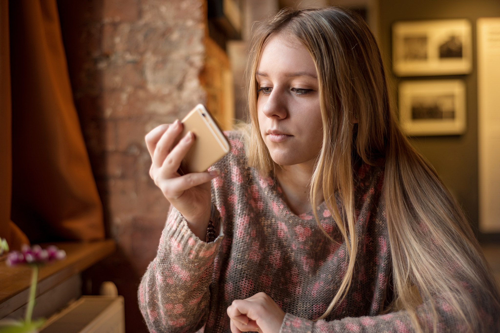 Teenage girl looking at smart phone