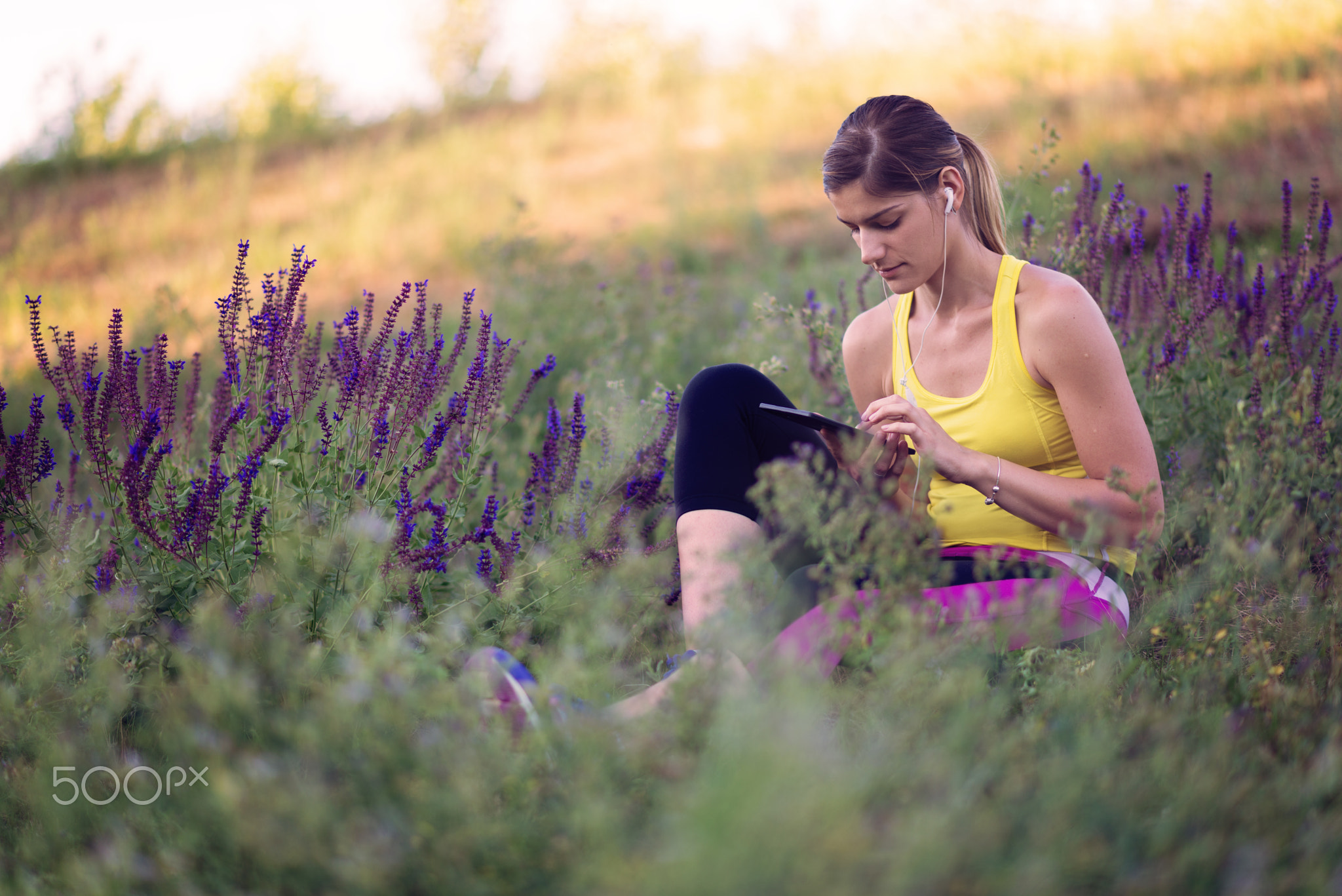 Sportswoman listening to the music after workout