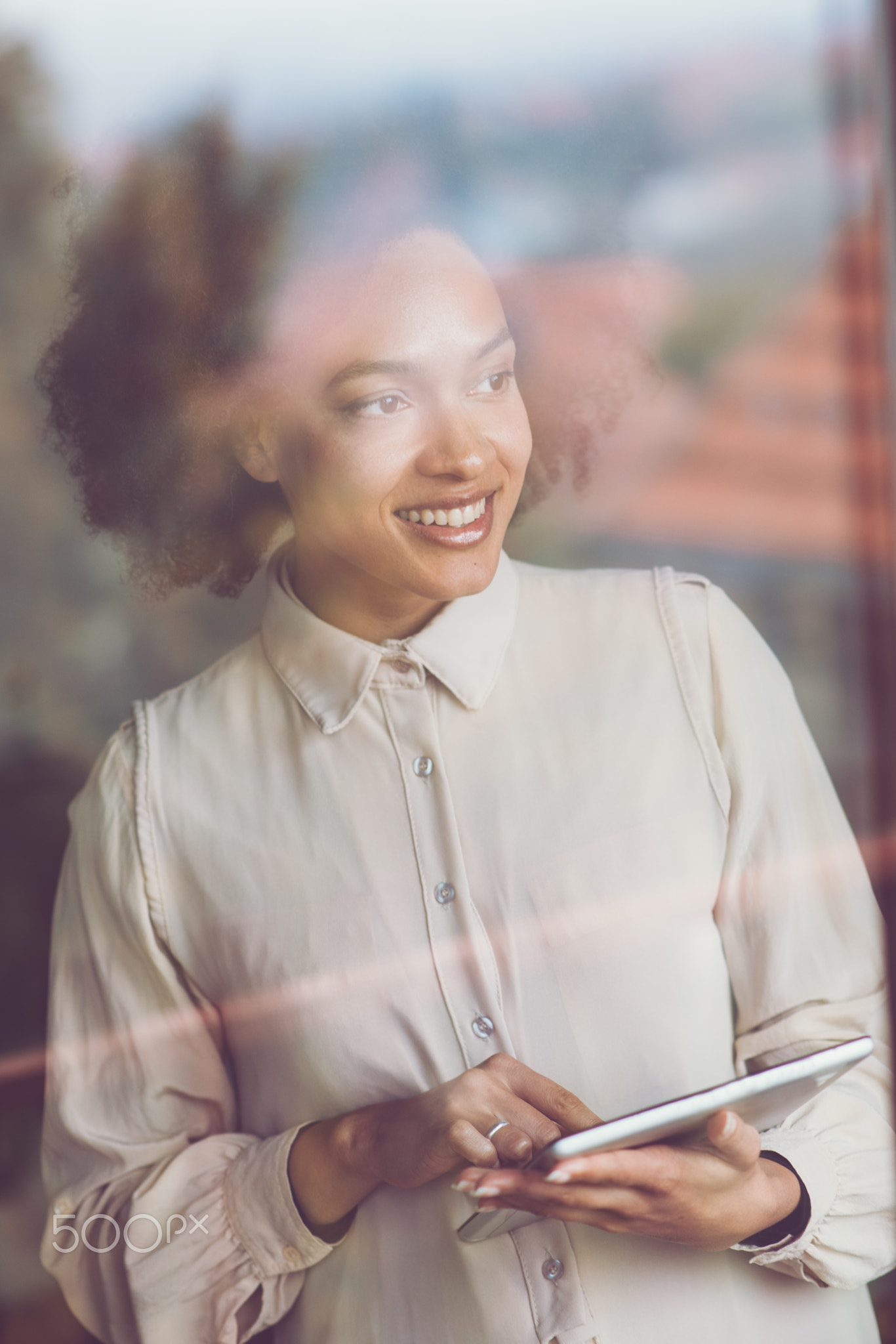 Smiling woman using tablet