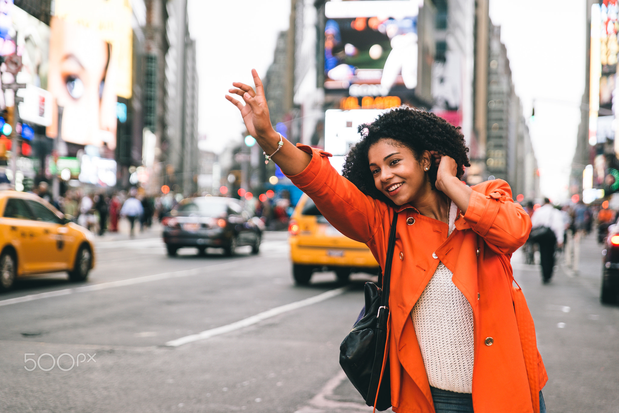 Woman looking for a taxi in New york city