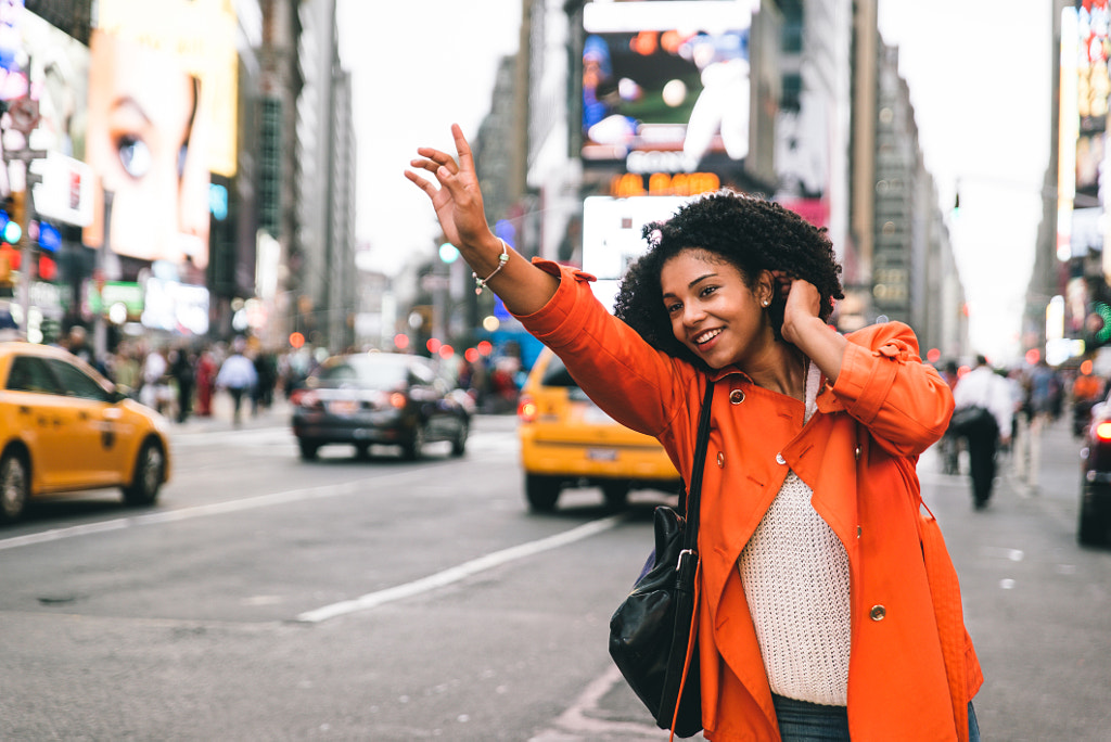 Woman looking for a taxi in New york city by Cristian Negroni on 500px.com