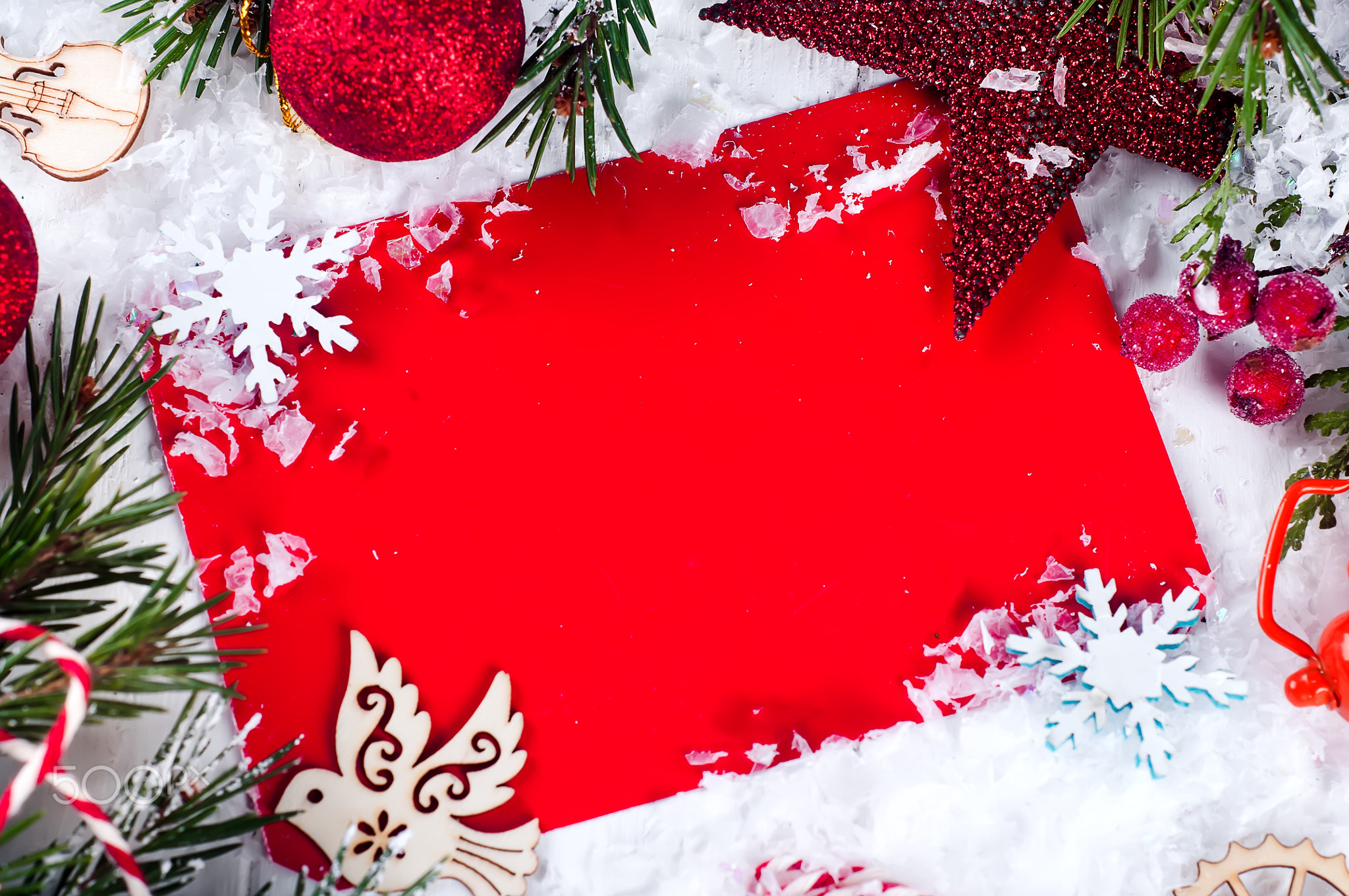 Christmas card with decorated fir tree on snow.