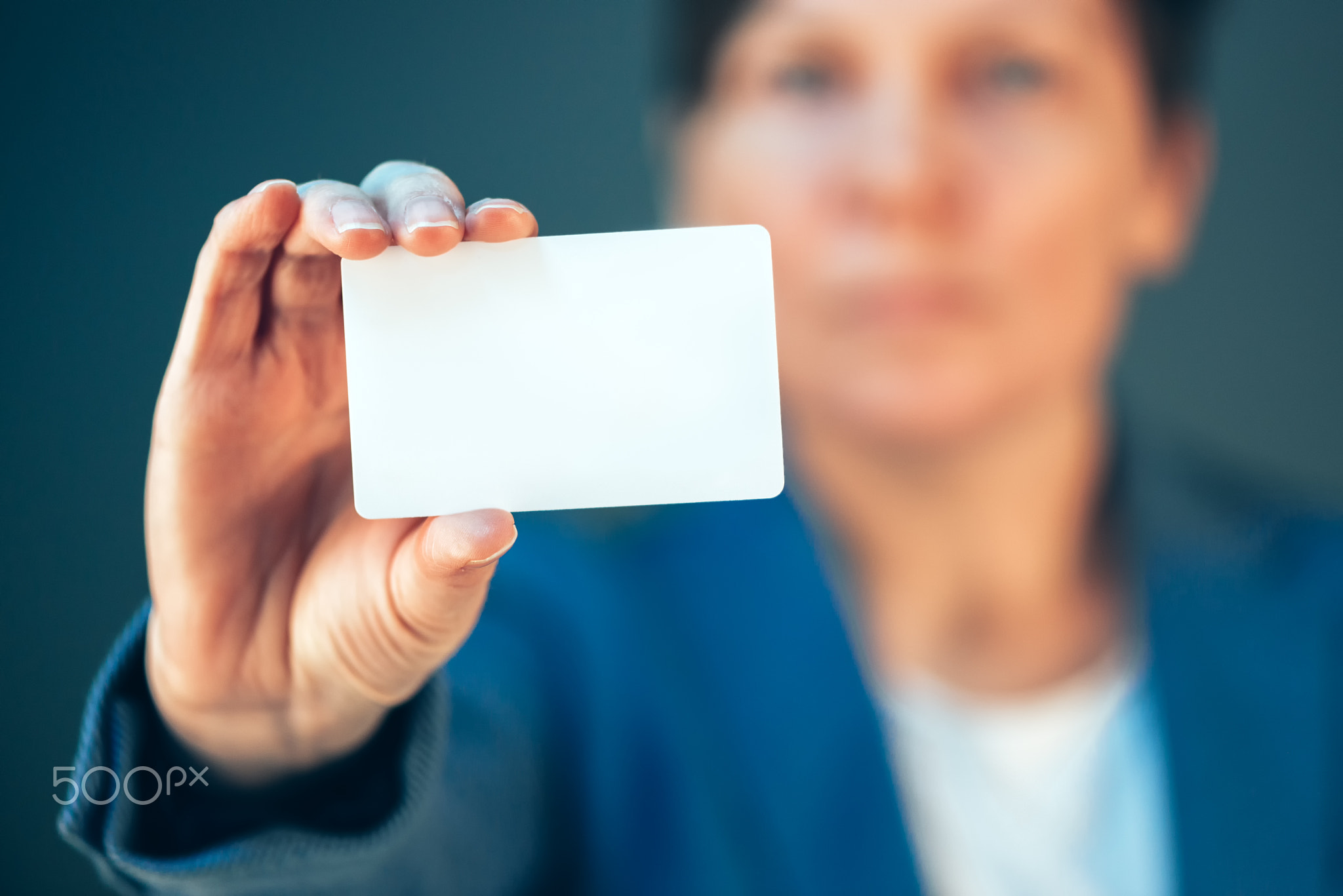 Businesswoman holding blank business card as copy space