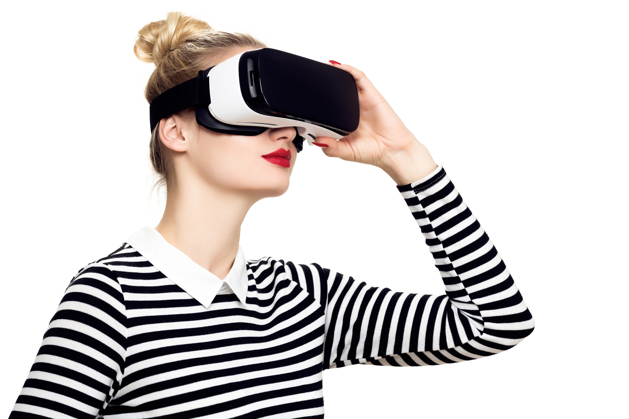 Attractive woman wearing virtual reality glasses. VR headset. Virtual reality concept on white...