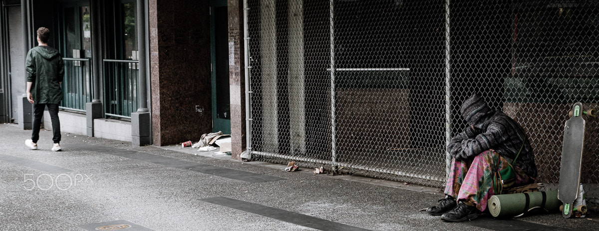 Nikon D500 sample photo. Homeless guy passing the time on a vancouver city street photography
