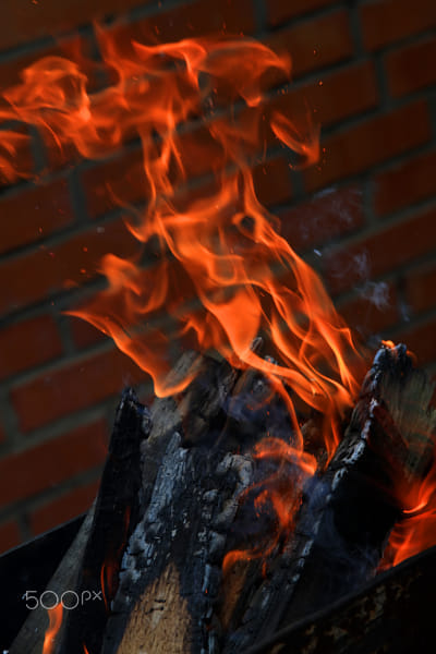 burning wood in a brazier by Nick Patrin on 500px.com