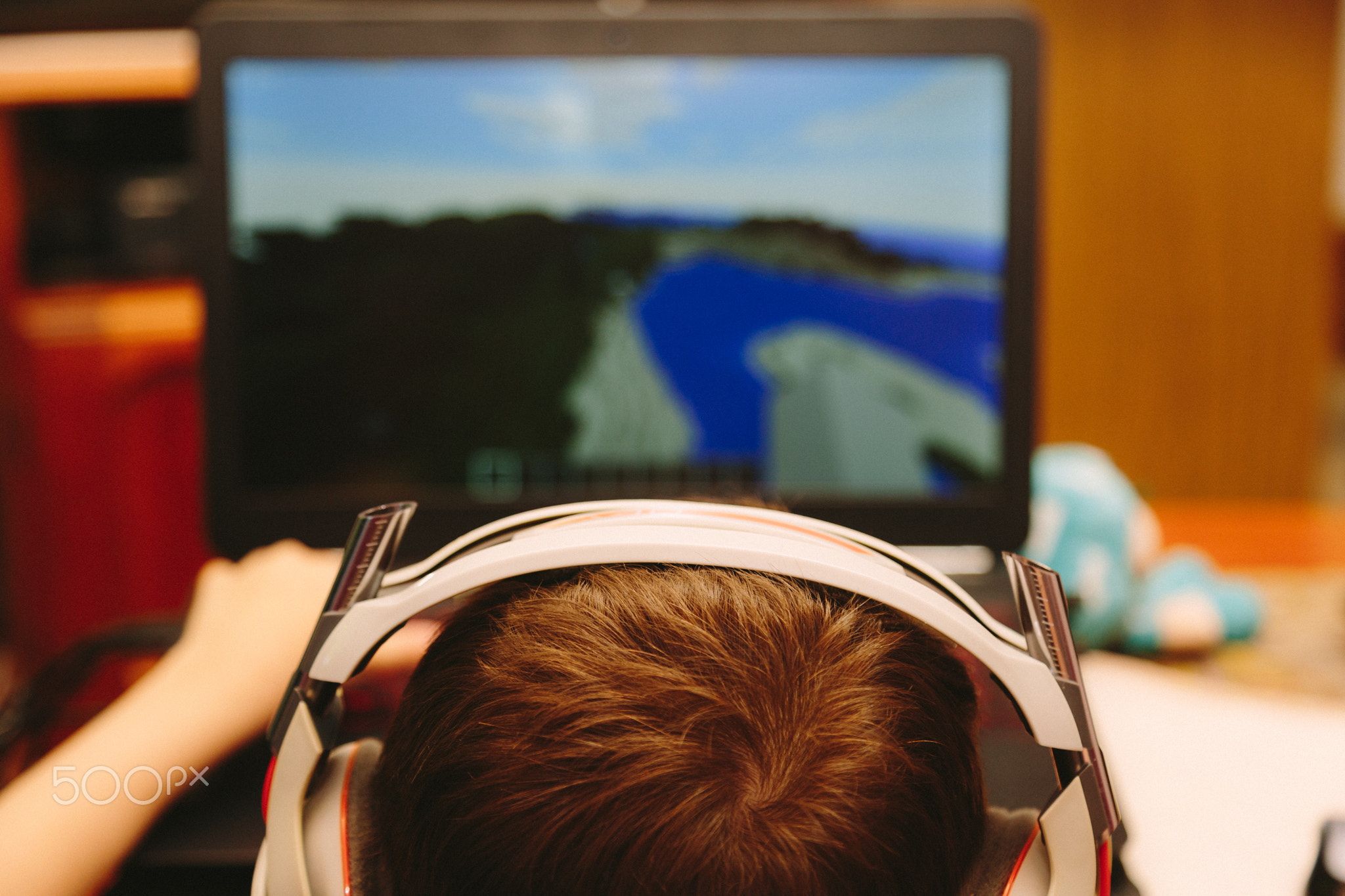 Young boy playing on computer