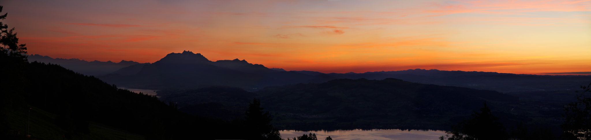 Canon EOS 500D (EOS Rebel T1i / EOS Kiss X3) sample photo. Vibrant mountain sunset over lake photography