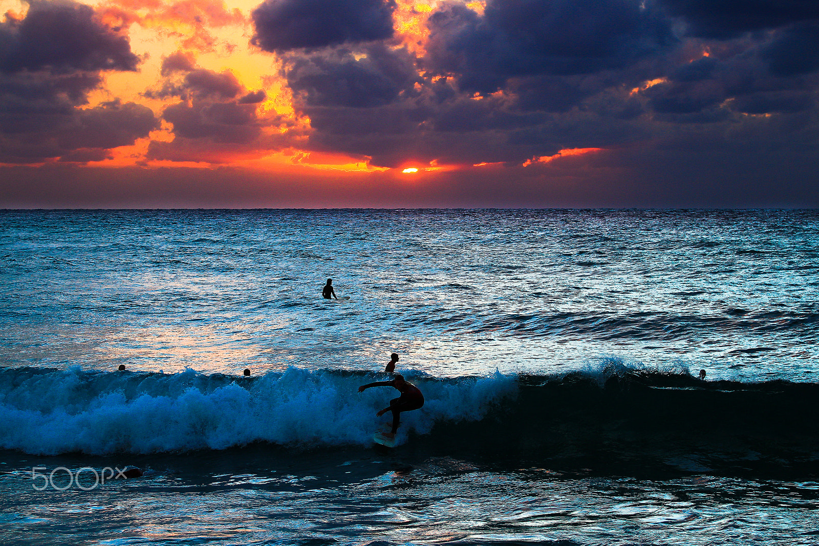 Canon EOS 600D (Rebel EOS T3i / EOS Kiss X5) + Canon EF 70-200mm F4L USM sample photo. Surfers at sunset - tel-aviv beach photography