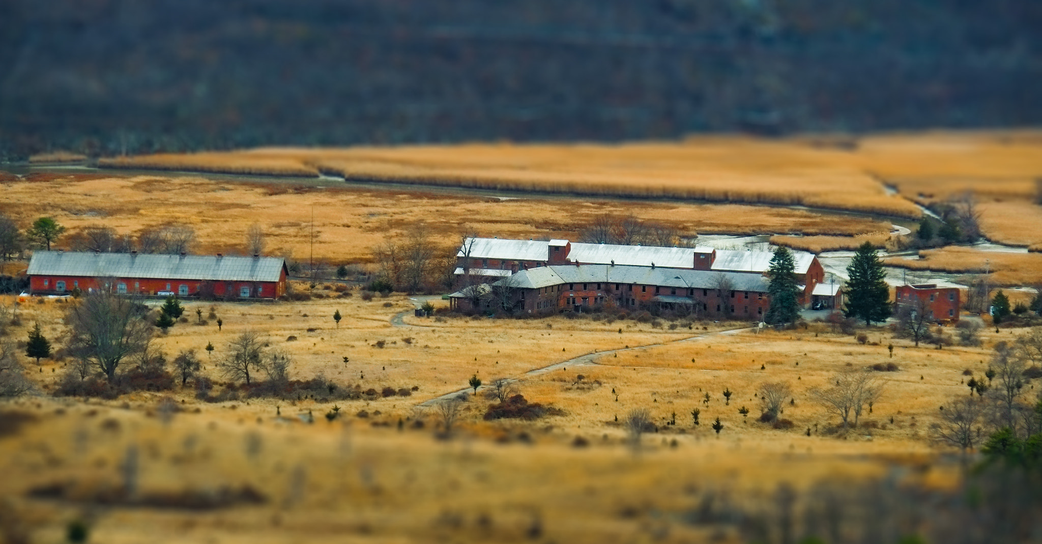 Fujifilm X-E1 + Fujifilm XF 18-135mm F3.5-5.6 R LM OIS WR sample photo. Minature swamp and buildings photography