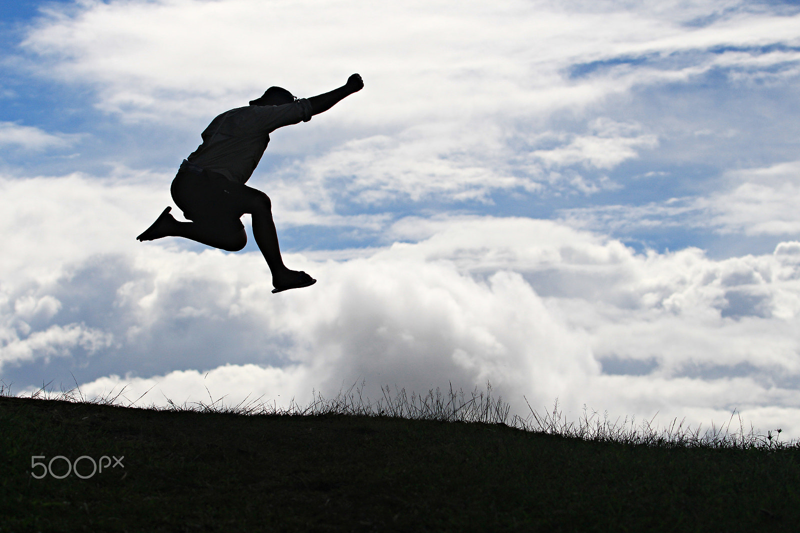 Canon EF 70-200mm F2.8L USM sample photo. Silhouette man jump over the land photography