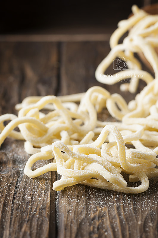 Nikon AF-S Micro-Nikkor 105mm F2.8G IF-ED VR sample photo. Italian homemade uncooked pasta on the wooden table photography