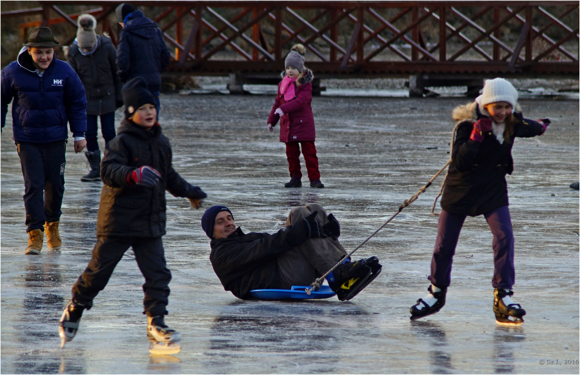 Minolta AF 70-210mm F4 Macro sample photo. Sliding on an iced lake photography