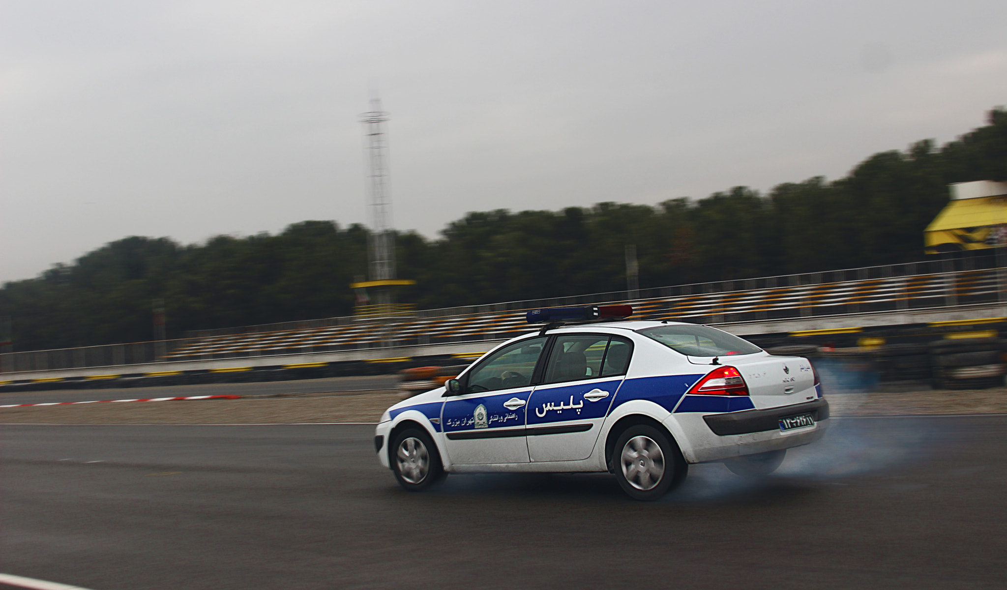 Canon EF 28-135mm F3.5-5.6 IS USM sample photo. Police car drift photography