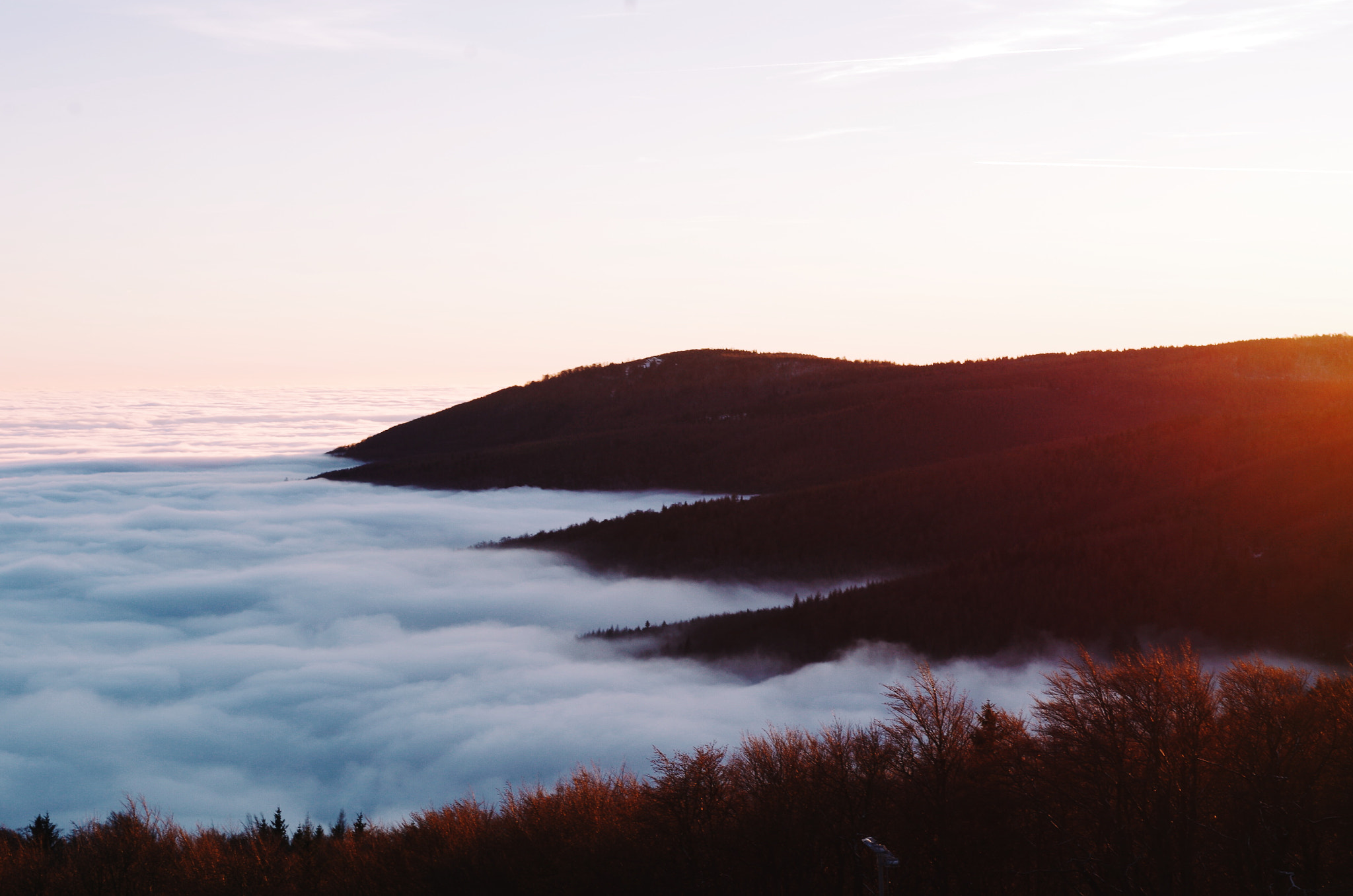 Pentax K-50 sample photo. Sunset at mountains, fog is down at valley photography