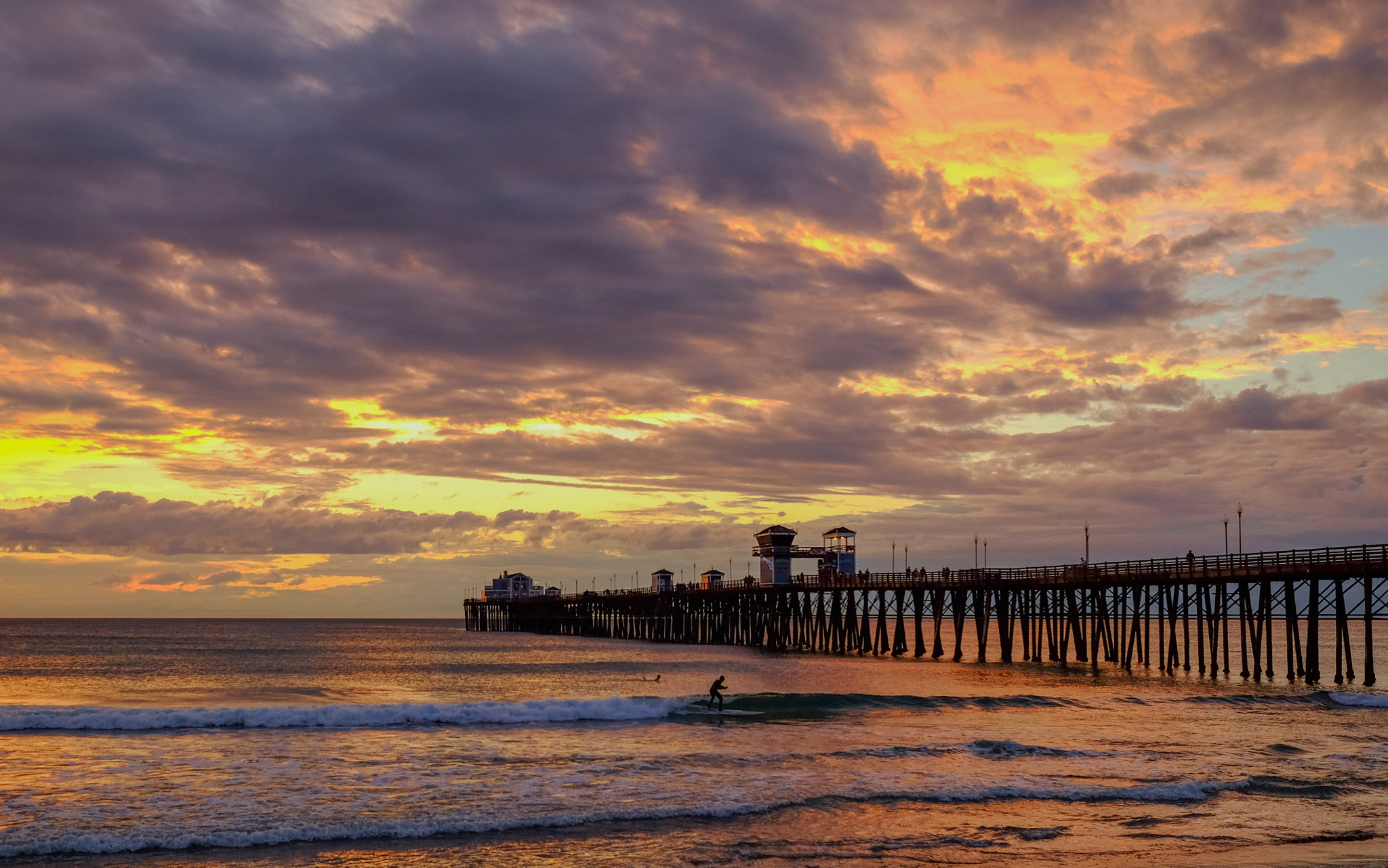 Fujifilm X-T10 + Fujifilm XF 10-24mm F4 R OIS sample photo. Surfer and pier photography