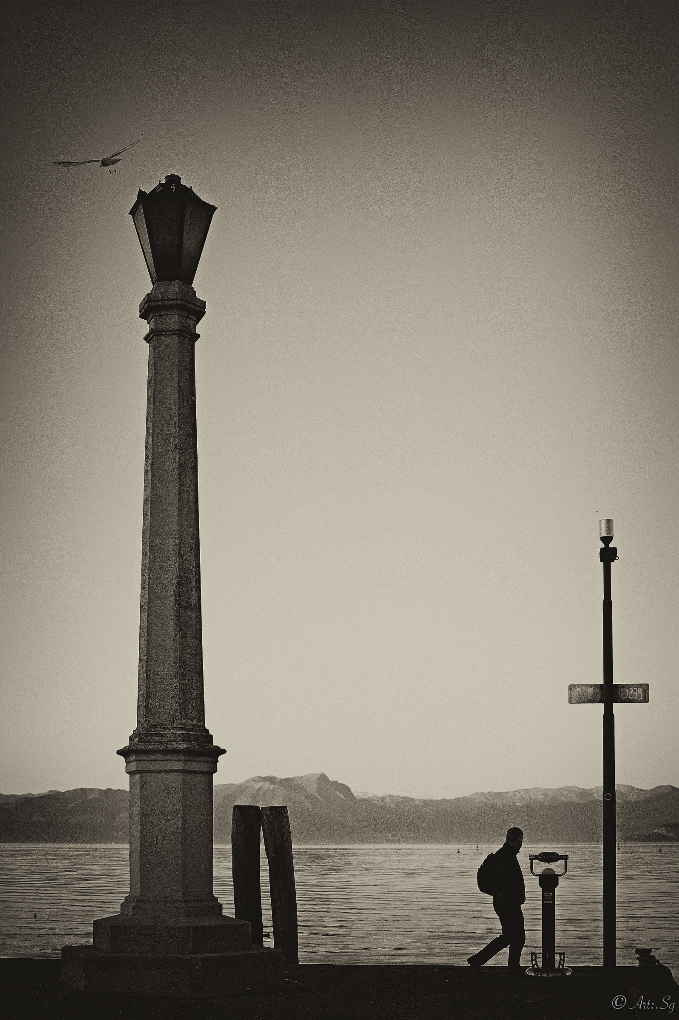 Canon EF-S 24mm F2.8 STM sample photo. Alone  the shores of lake garda photography
