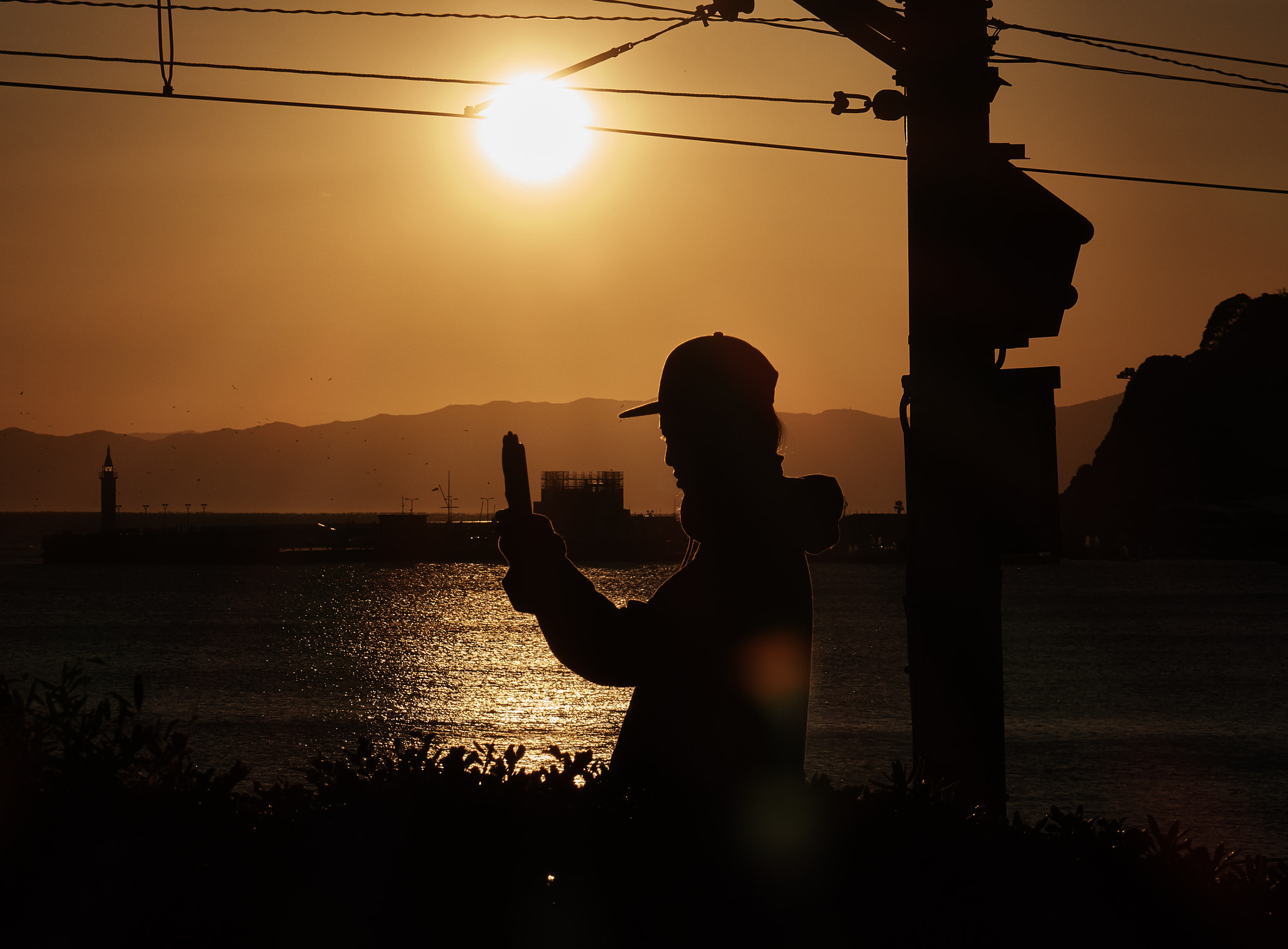 Sony Cyber-shot DSC-RX10 sample photo. A man at sunset photography