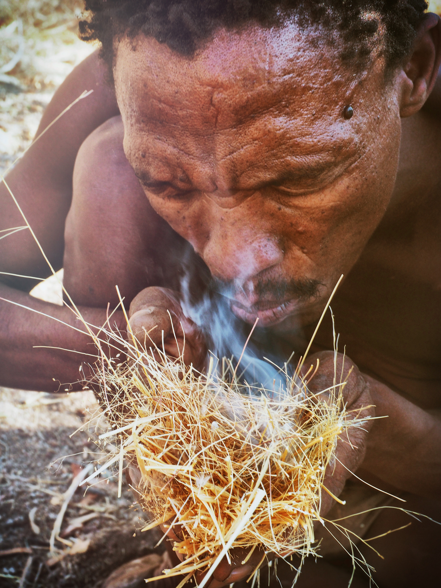Olympus M.Zuiko Digital ED 12-40mm F2.8 Pro sample photo. San bushman on fire photography