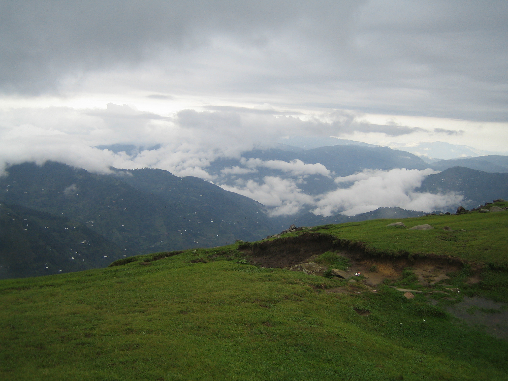Canon DIGITAL IXUS 40 sample photo. Rainy clouds above green mountains photography