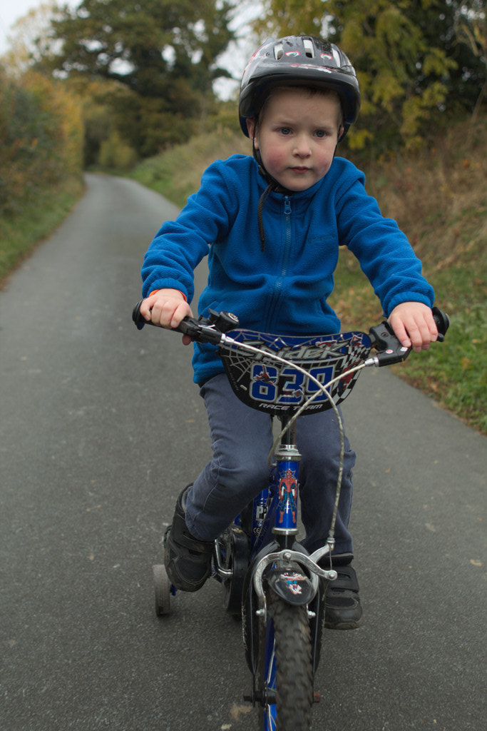 Canon EF 28mm F1.8 USM sample photo. Boy riding bike photography
