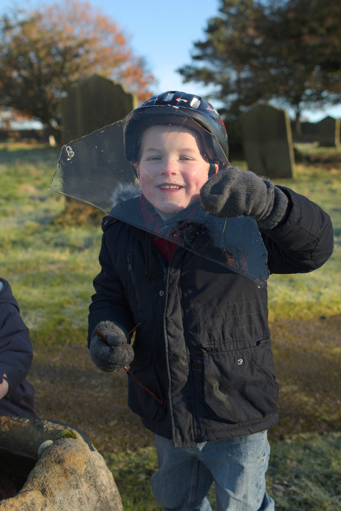 Canon EF 24mm F1.4L II USM sample photo. Boy looking through ice photography