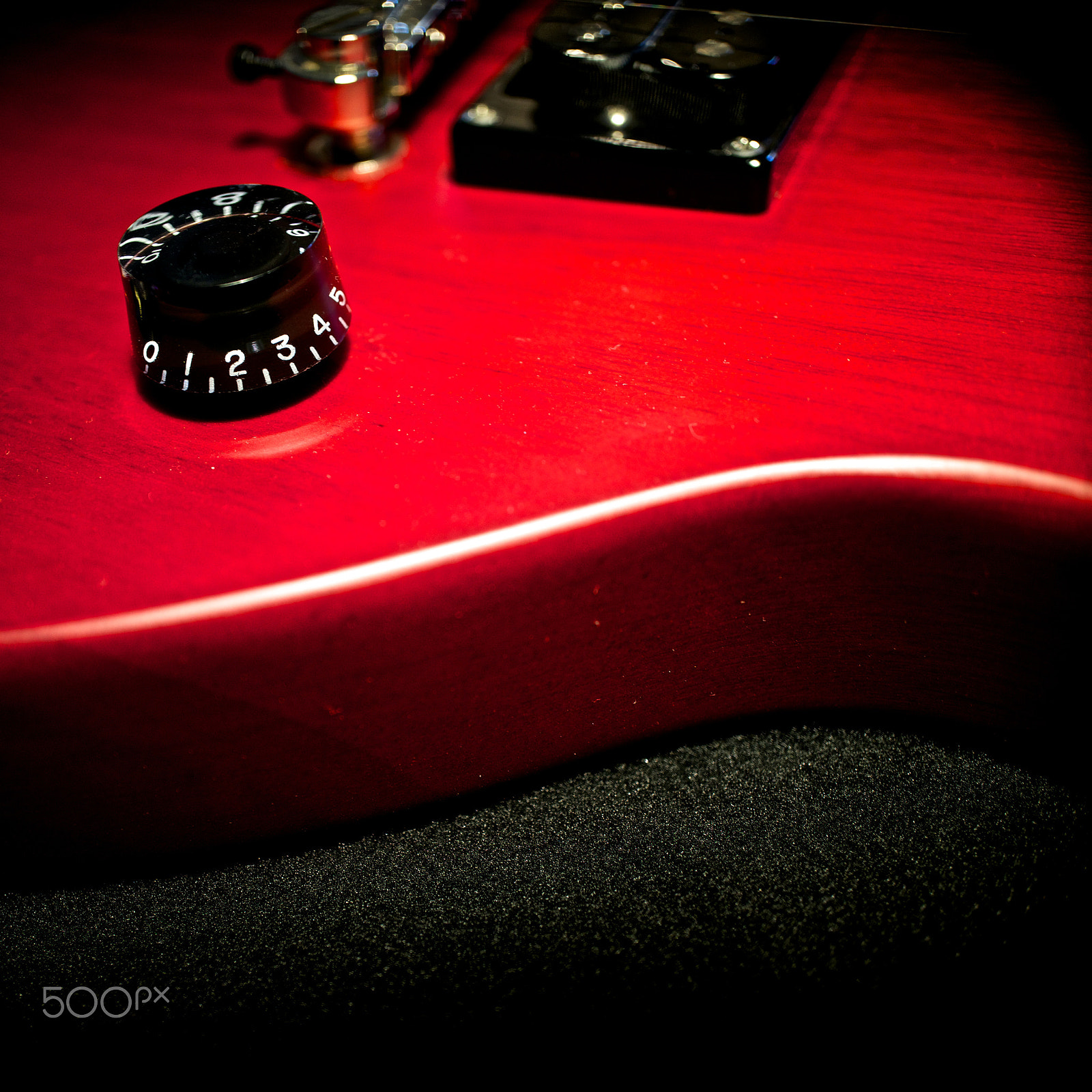 Sony E 30mm F3.5 sample photo. Red guitar body photography