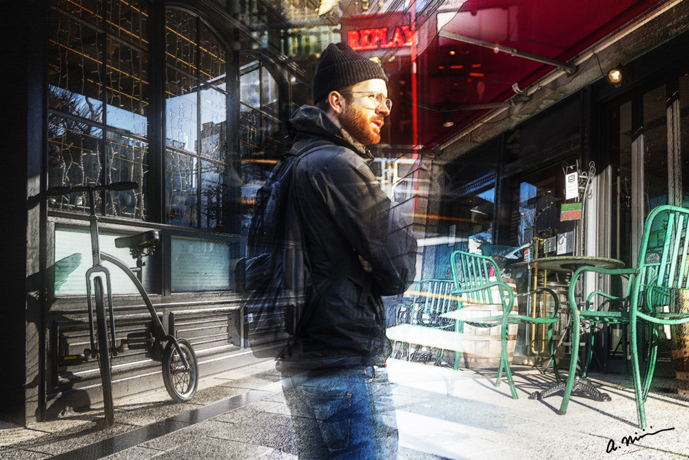 Canon EF-M 11-22mm F4-5.6 IS STM sample photo. A man walk around the street photography