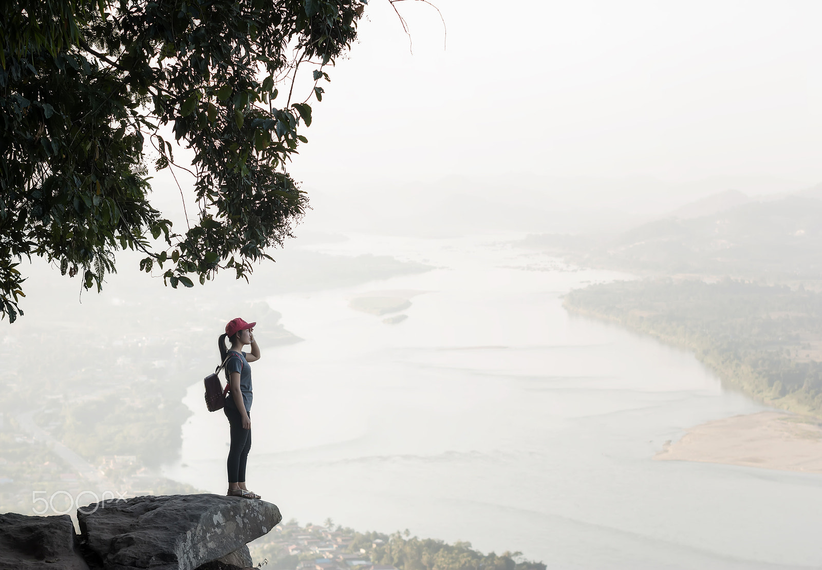 Sigma 70-200mm F2.8 EX DG OS HSM sample photo. Young woman standing on cliff's edge and looking into a wide val photography