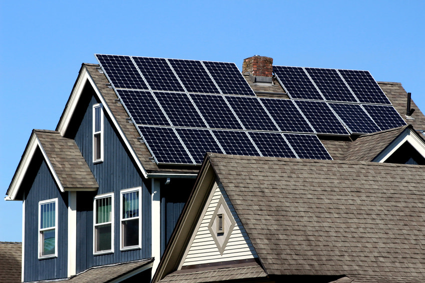 Canon EF 80-200mm F4.5-5.6 II sample photo. Solar panels installed and in use on the roof of a home photography