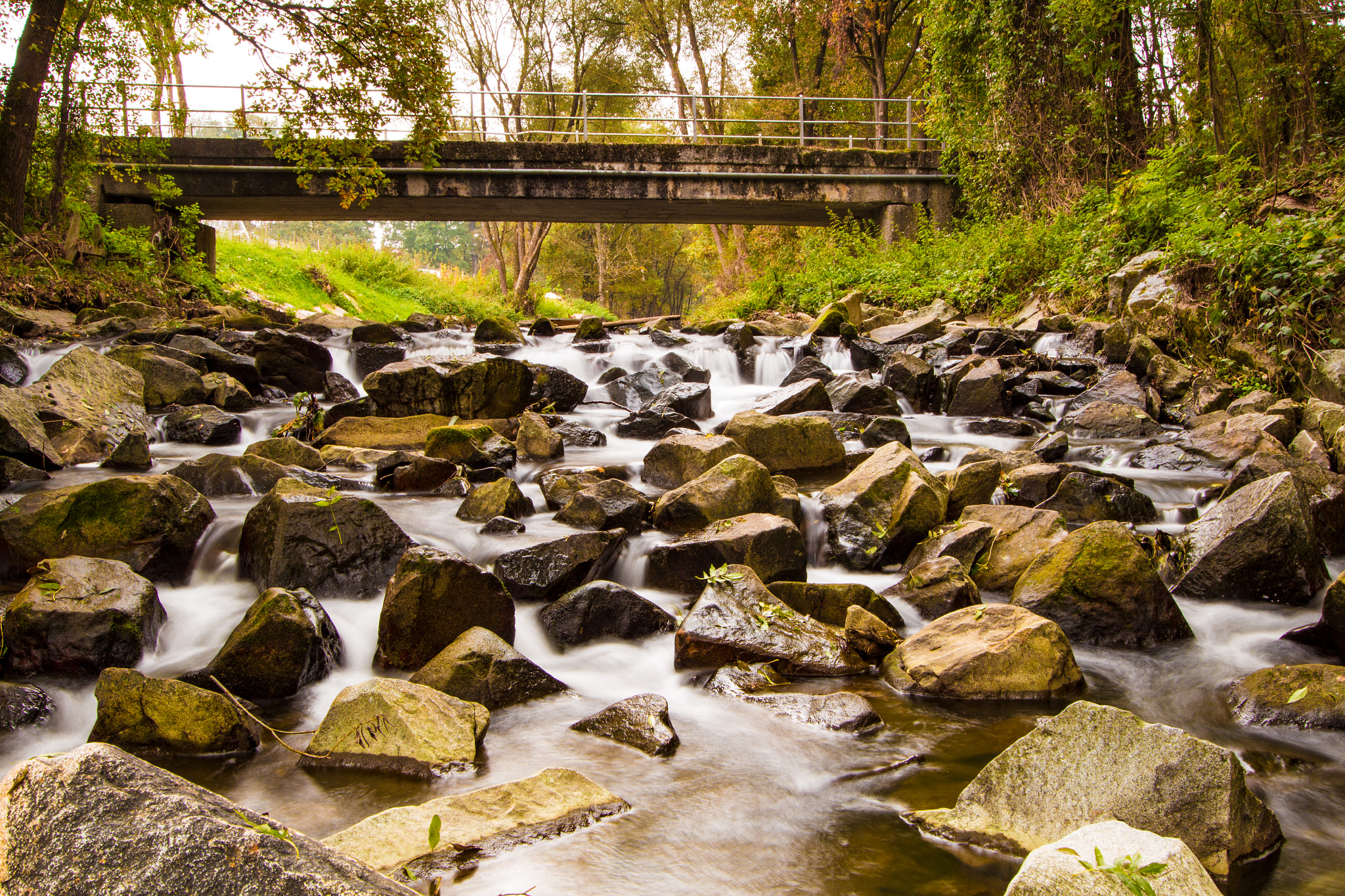 Canon EF-S 10-22mm F3.5-4.5 USM sample photo. River past some stones photography