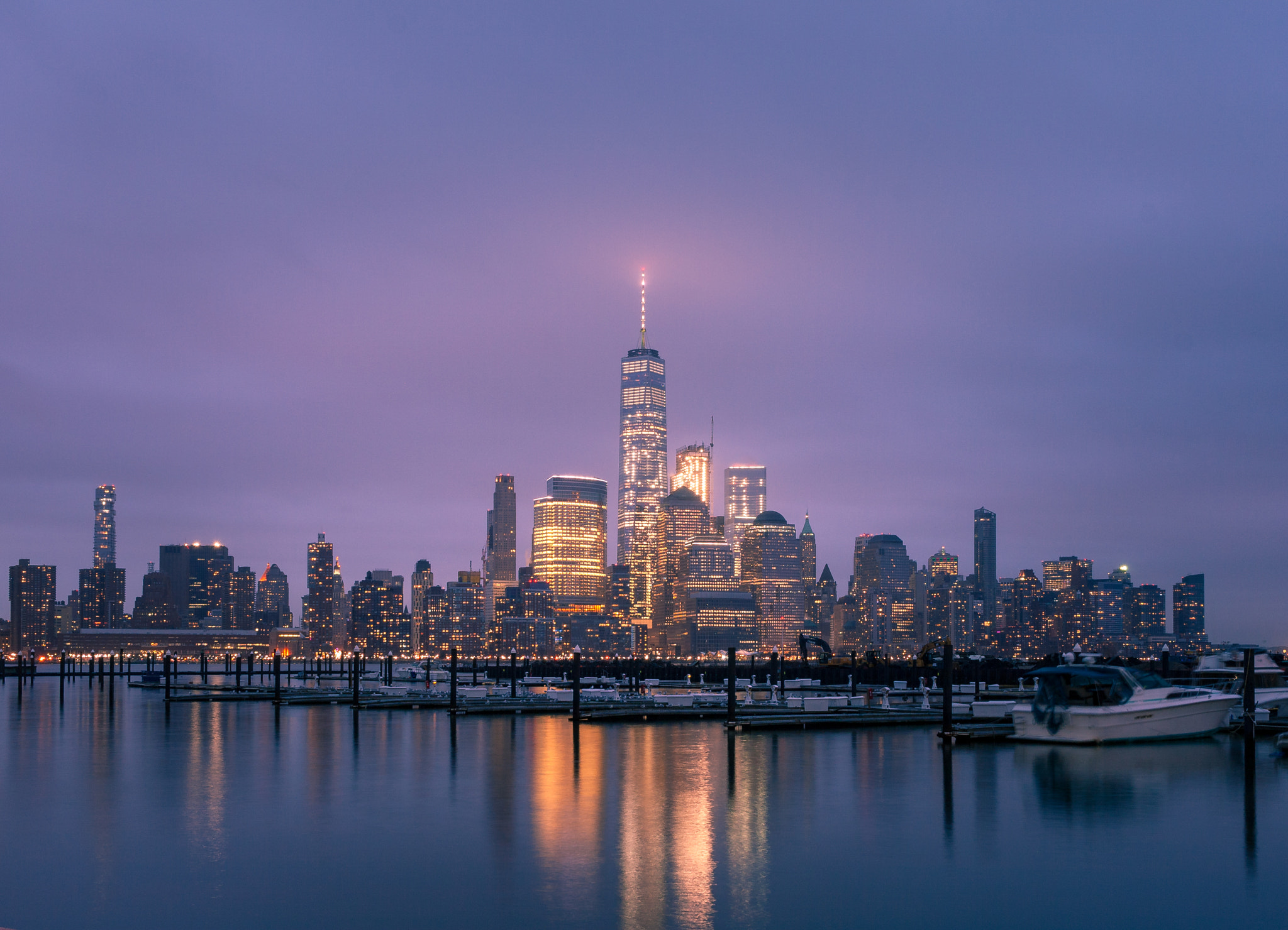 Canon EOS 400D (EOS Digital Rebel XTi / EOS Kiss Digital X) + Canon EF-S 24mm F2.8 STM sample photo. Rain, fog, sunset and one world trade center photography