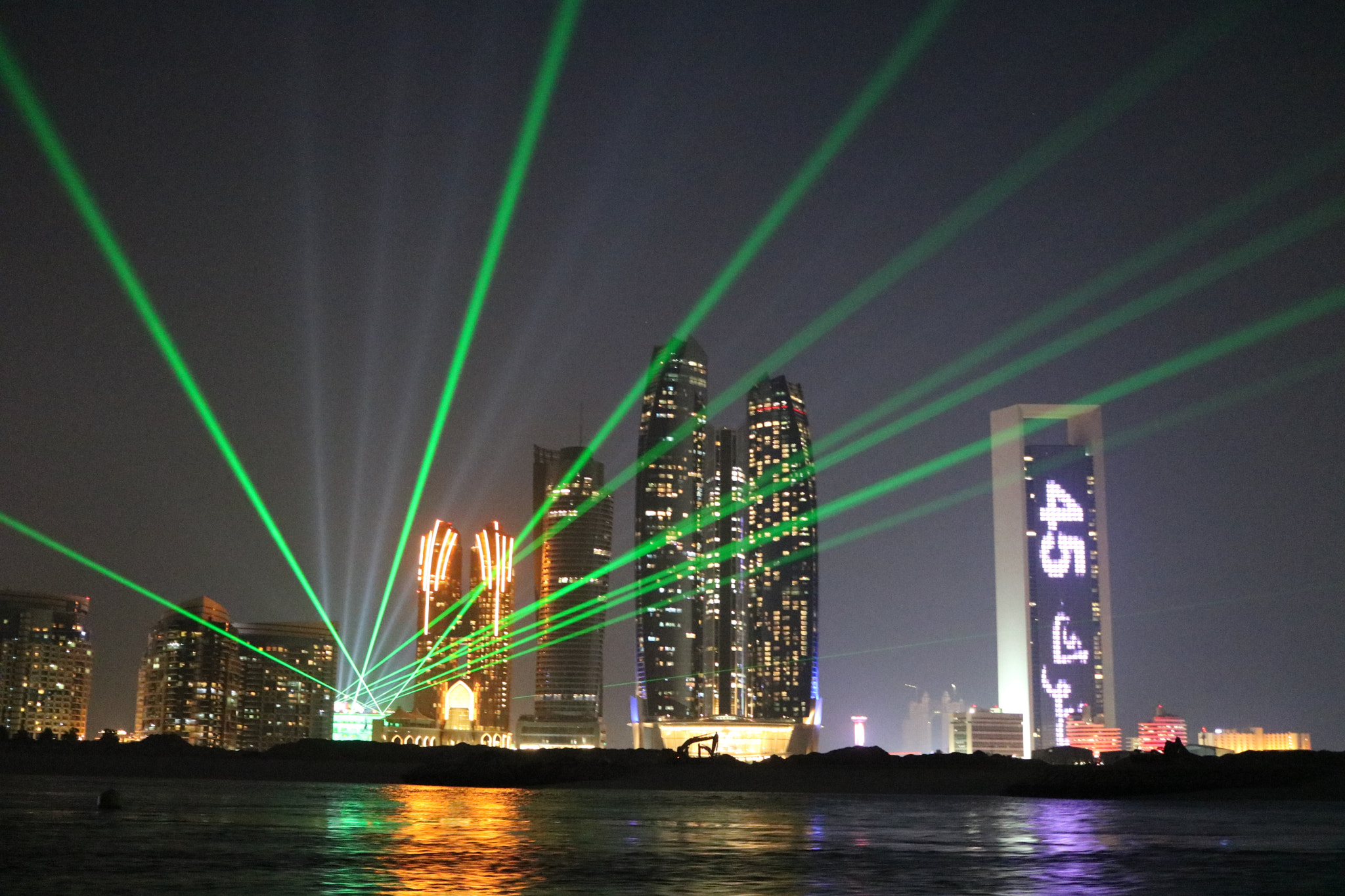 Canon EF-S 24mm F2.8 STM sample photo. Etihad towers at night photography