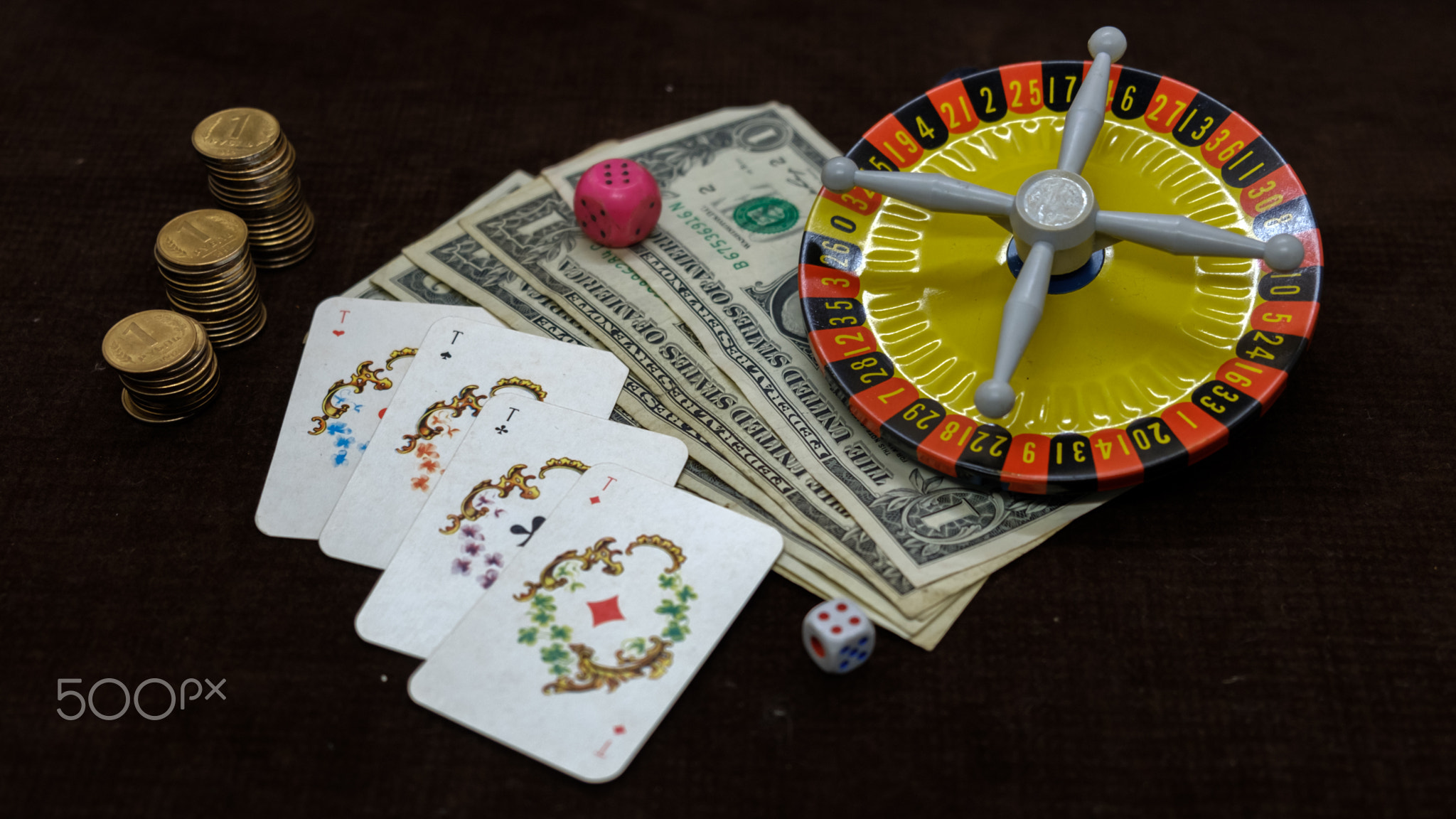 Money cards and roulette on a dark background
